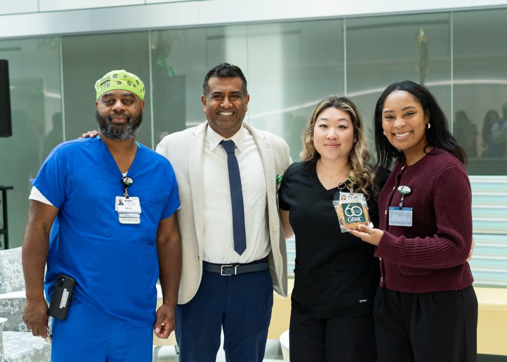 Employees with Dr. Gopalakrishnan at the 60th Anniversary Employee Celebration