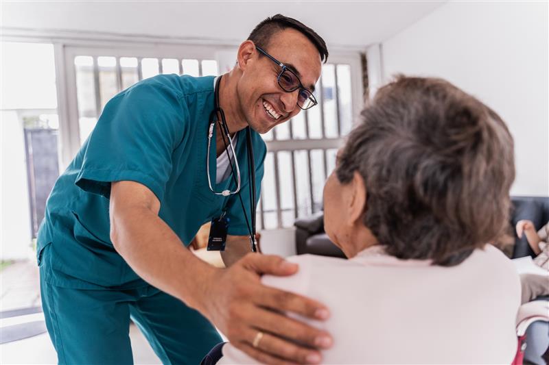 Health care provider assisting a woman