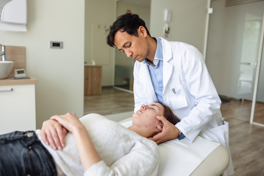 A doctor examining a patient