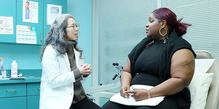 Dr. Liu with a patient 