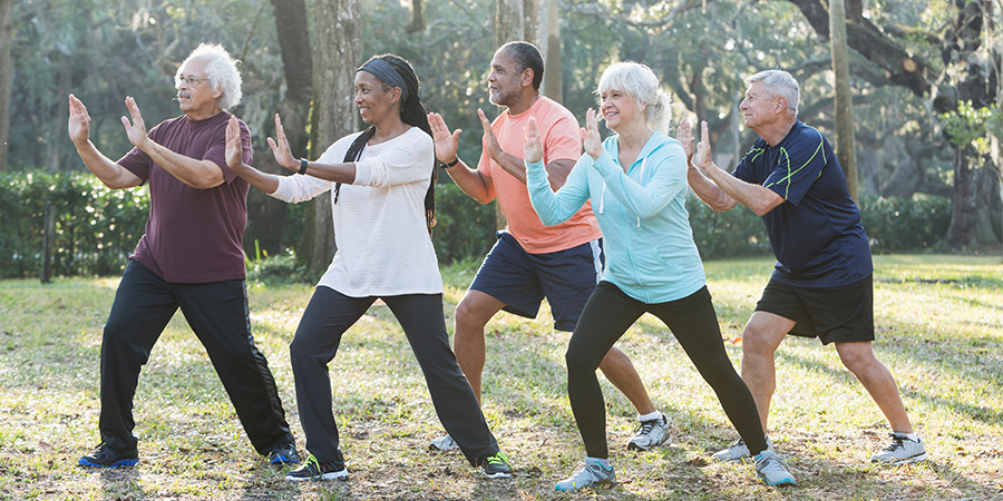 Group doing tai chi in the park