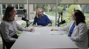 Dr. Joan Blomquist, Mary Beth Marsden, and Dr. Christine Helou around a table talking into mics for the In Full Bloom podcast