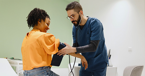 Image depticting a medical assistant and patient