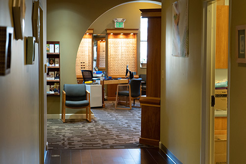 Health care office hall with a small sitting area.