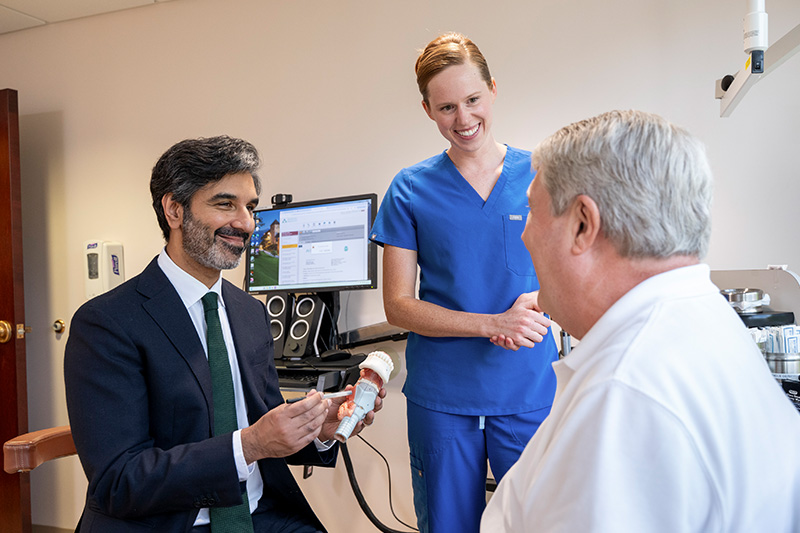 A GBMC speech-language pathologist explains head and neck anatomy to a patient