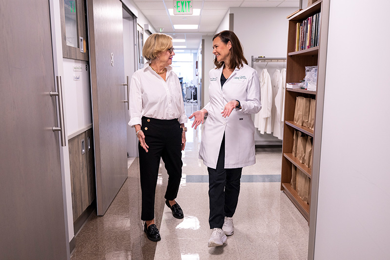 Irene Tyburski, PA-C, walking with a patient
