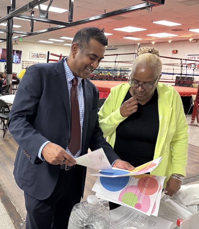 Paari Gopalakrishnan talking with Wanda Watters